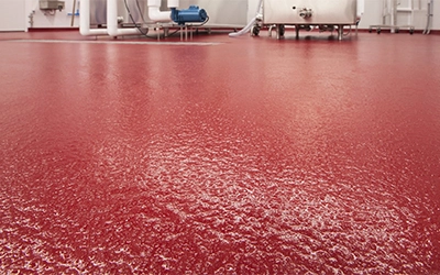 Cementitious urethane flooring system for heavy-duty industrial environments