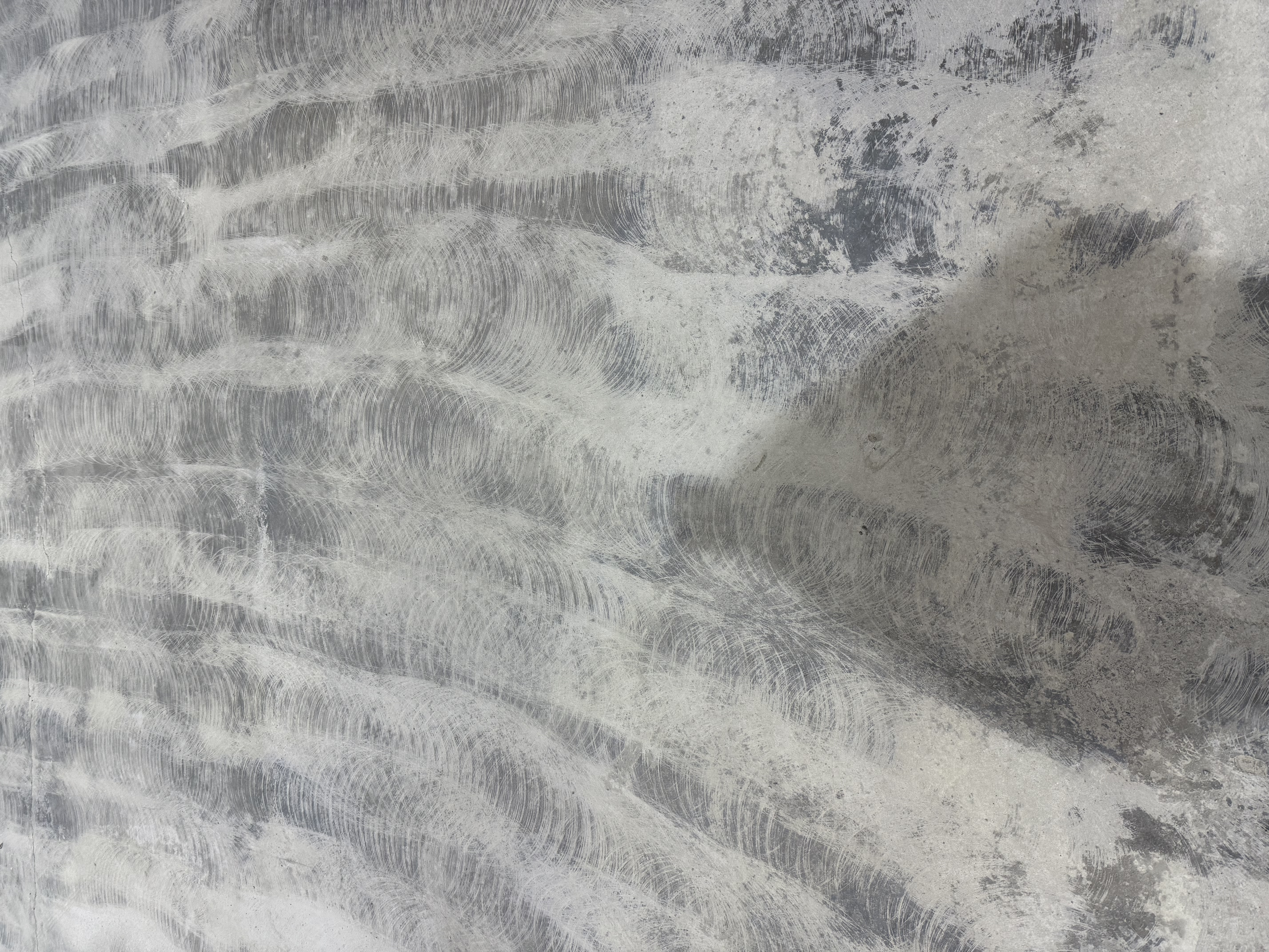 Industrial floor grinding machine prepping concrete substrate to ensure optimal coating adhesion