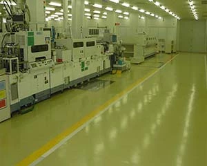 ESD conductive vinyl chip flooring system with decorative finish for electronics facilities and laboratories