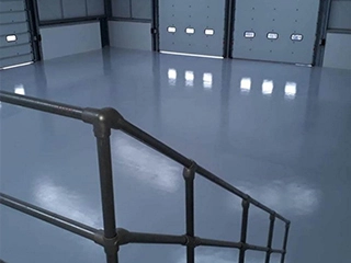 Heavy-duty moisture mitigation flooring system combining moisture control and mechanical durability for industrial facilities