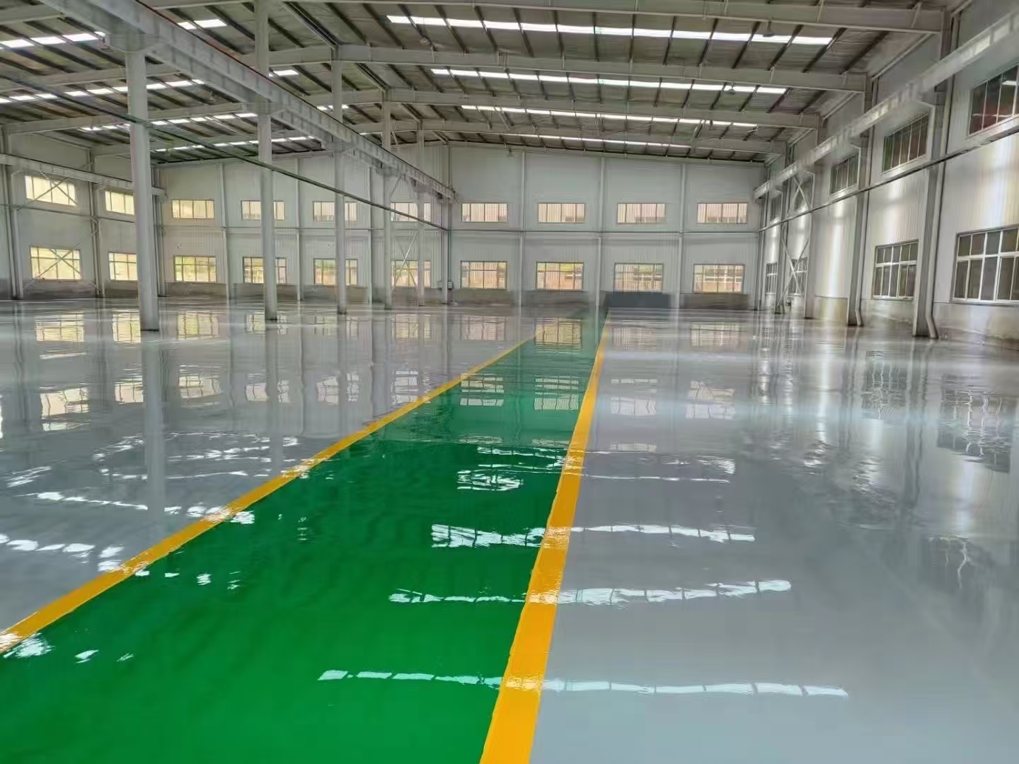 High brightness reflective warehouse epoxy flooring with diverse custom color zoning paths