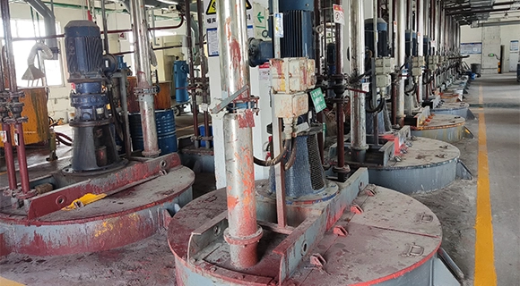 Industrial coating production line with mixing and packaging equipment