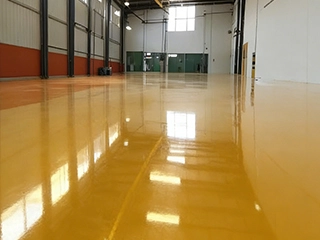 Moisture mitigation underlayment system for preparing challenging concrete substrates before high-performance resin flooring installation