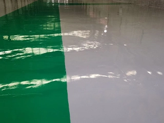 Moisture resistant self-leveling flooring system with seamless surface performance for commercial and industrial environments