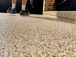 Polyaspartic broadcast flooring system with aggregate reinforcement for durable, slip-resistant industrial floor surfaces