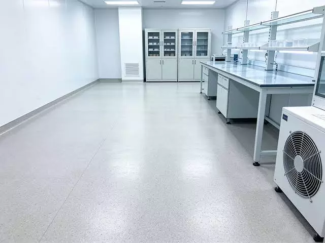 Chemical-resistant cementitious urethane flooring system for industrial processing areas