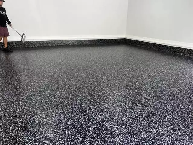 Flake broadcast cementitious urethane flooring system with decorative flake finish